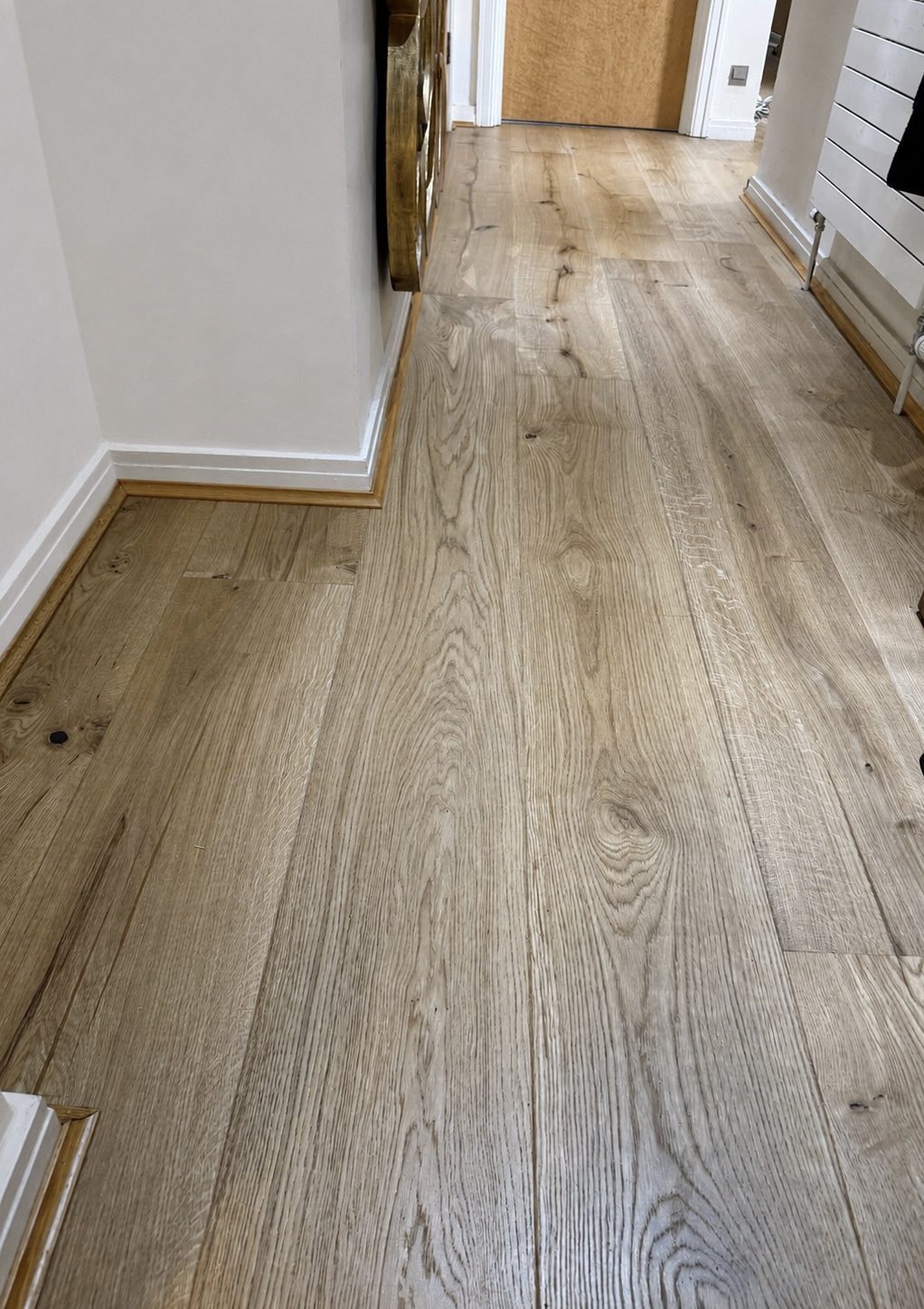 Rustic oak engineered flooring along a hallway, Fulham