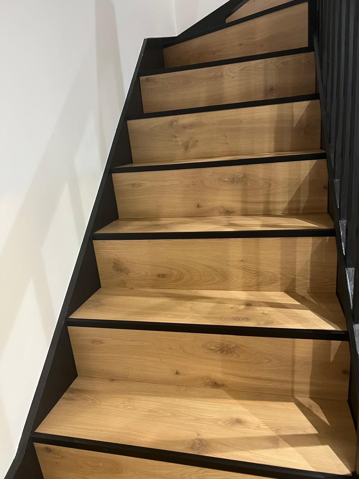 Upward view of a finished oak staircase
