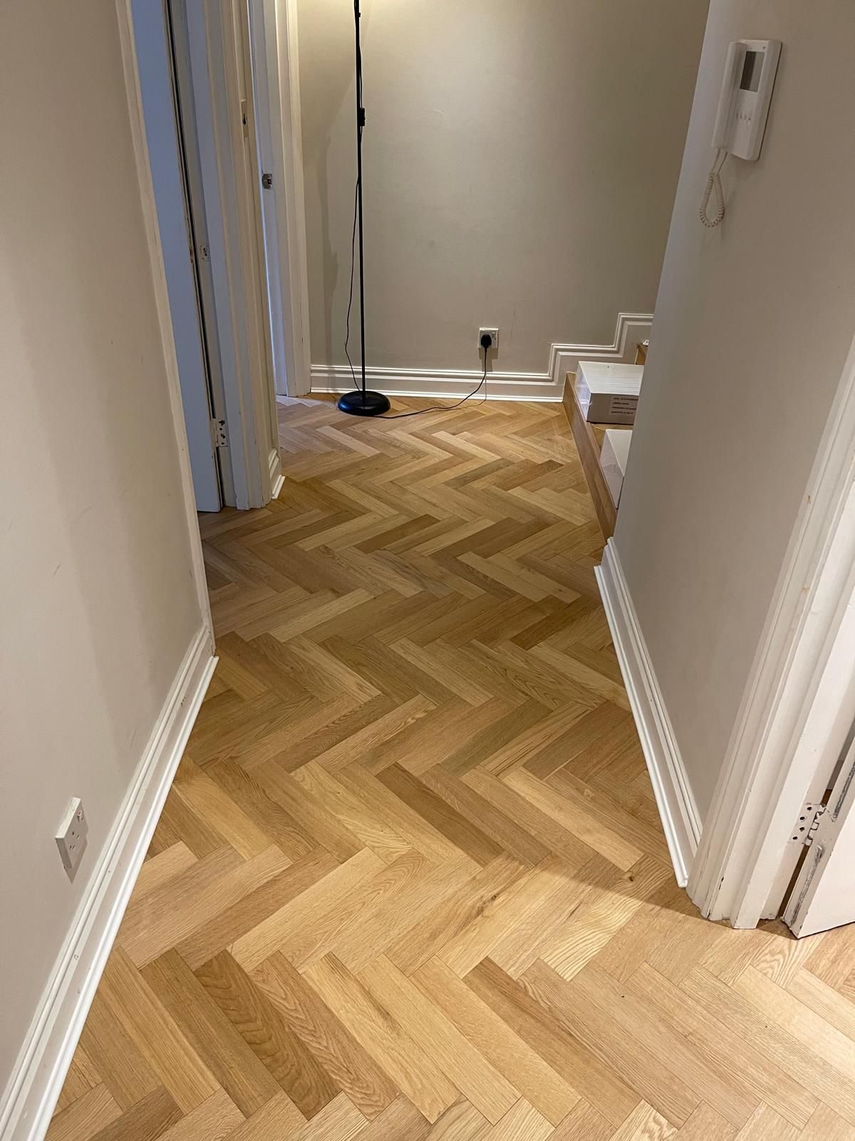 Herringbone flooring in a hallway leading to a staircase, Baker Street