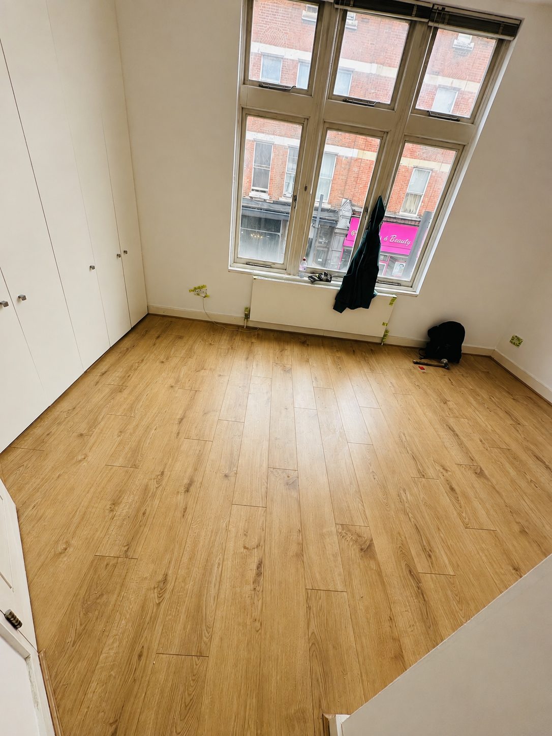 Wide-plank natural rustic oak flooring in a bright room