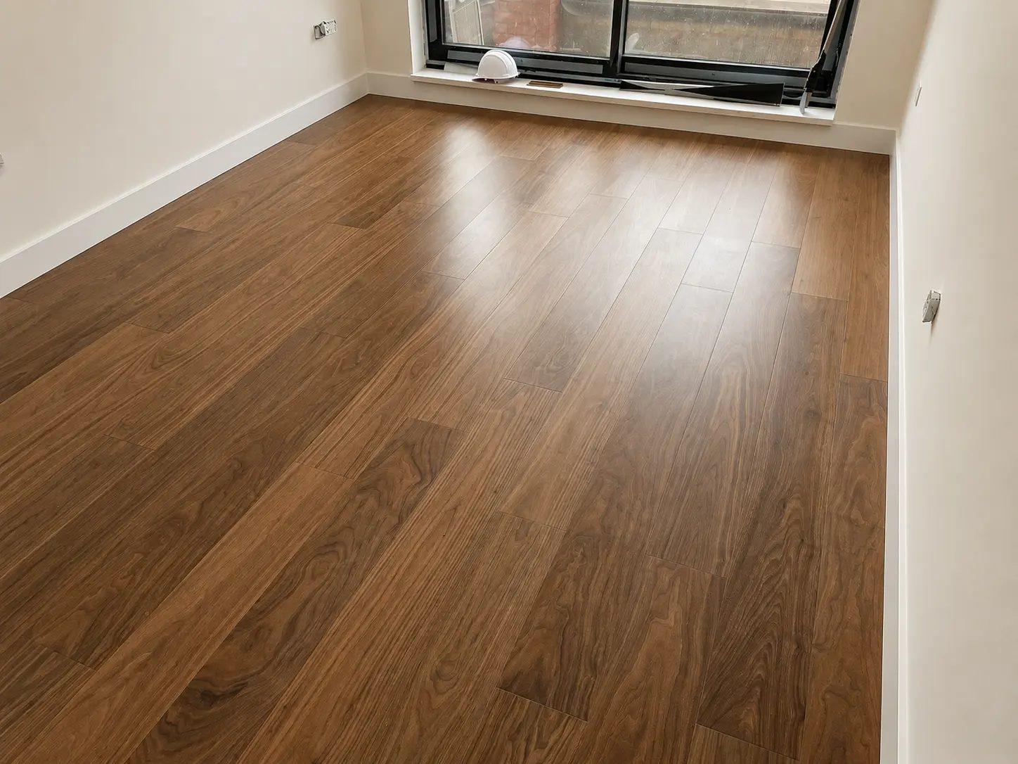 Medium brown engineered wood flooring in a newly finished room