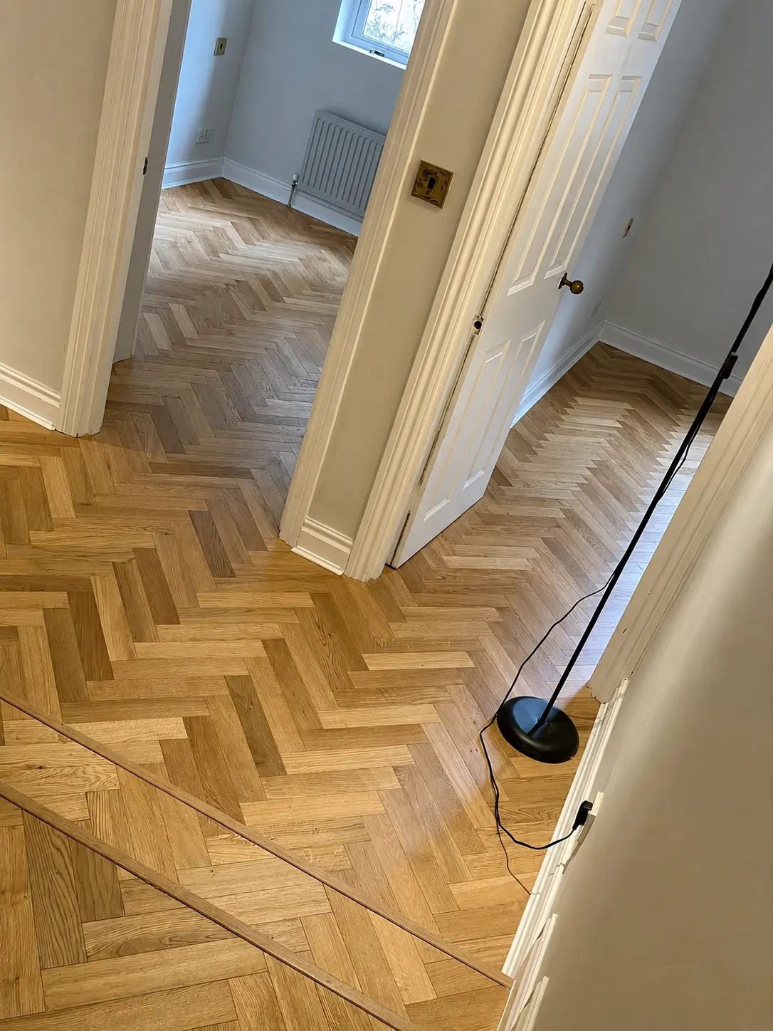Light oak herringbone flooring installed in Baker Street