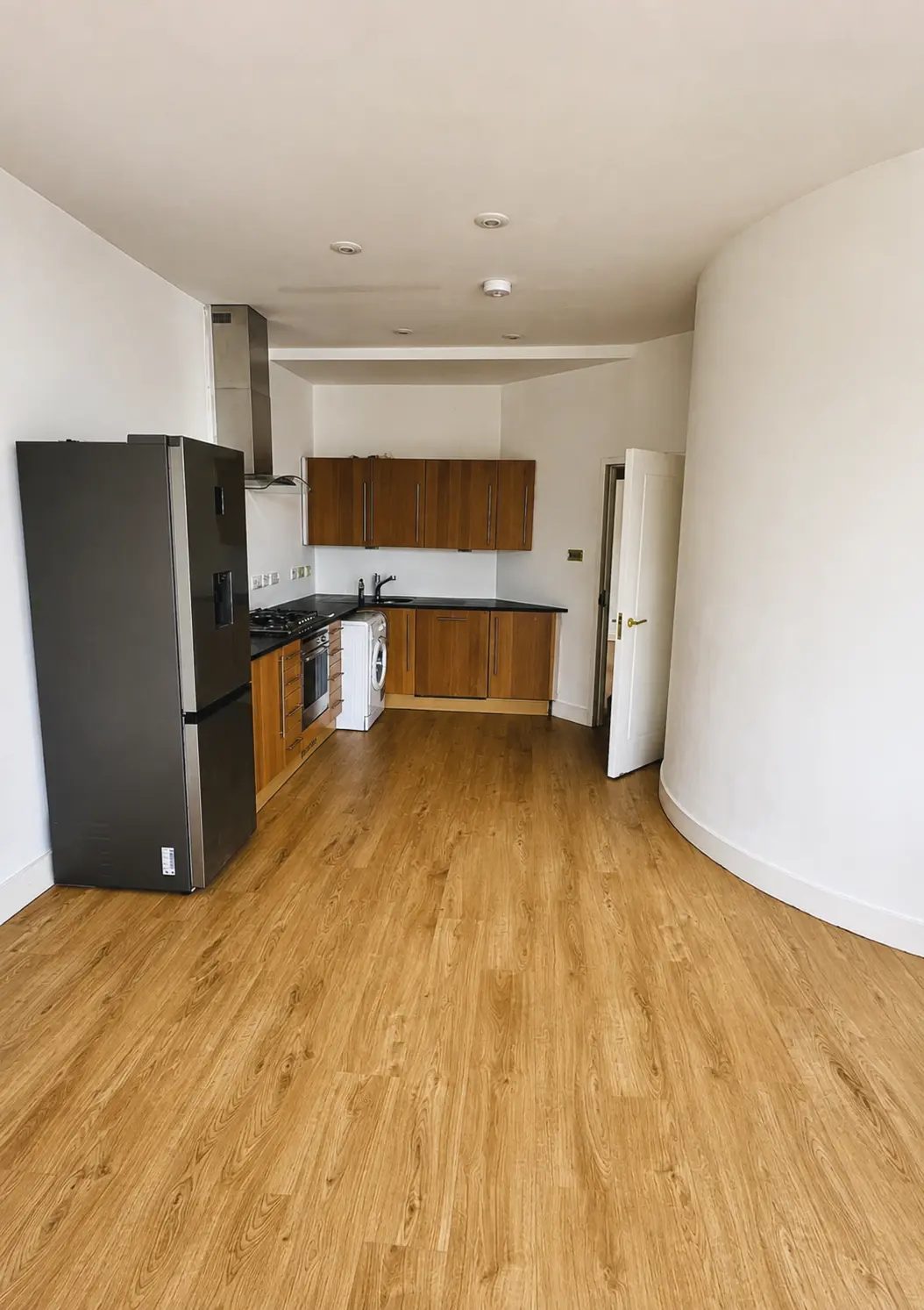 Engineered oak flooring in a kitchen with a curved wall