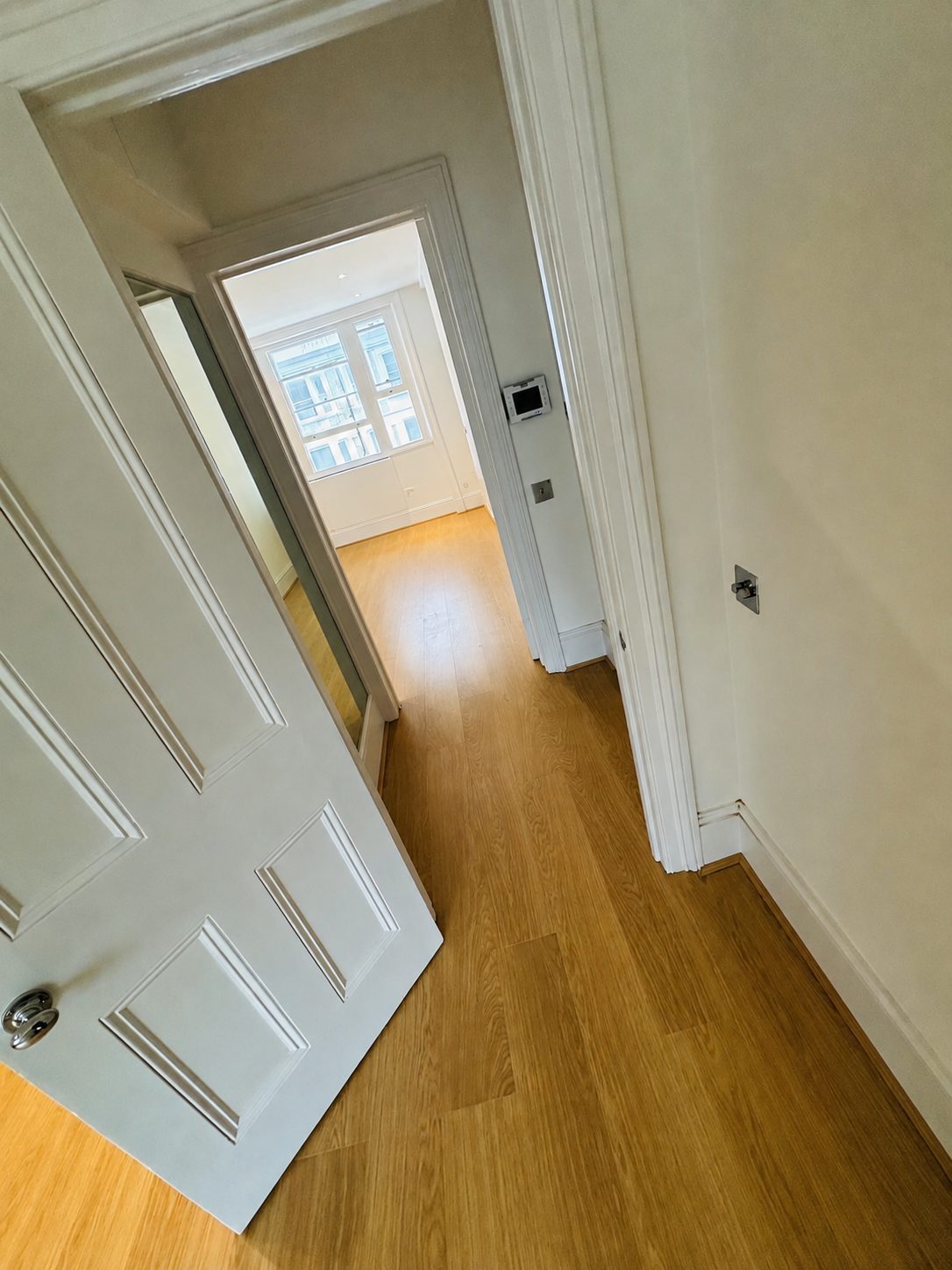 Engineered oak flooring seen through a doorway