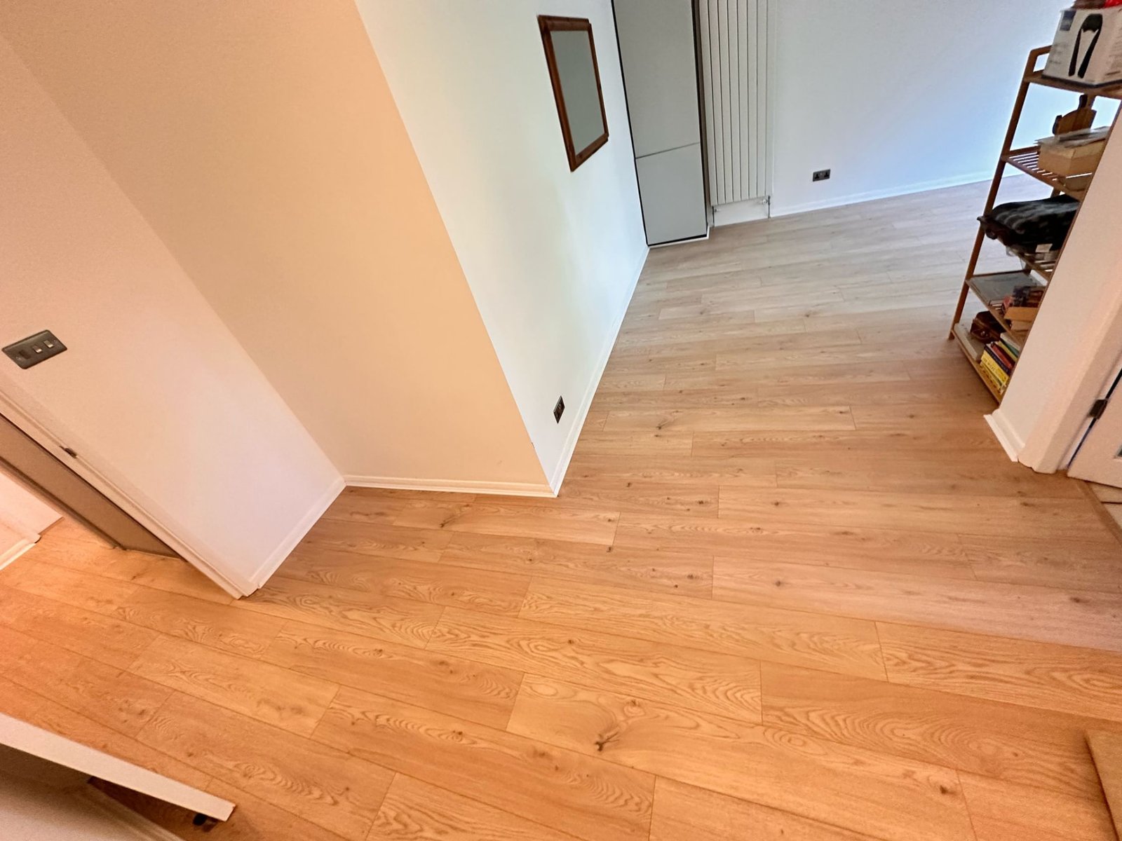 Pristine Flooring fitting marble-effect LVT tiles on a London project